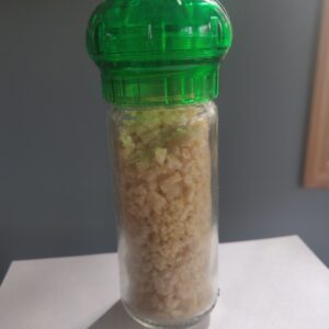 Garlic granules in refillable spice grinder.